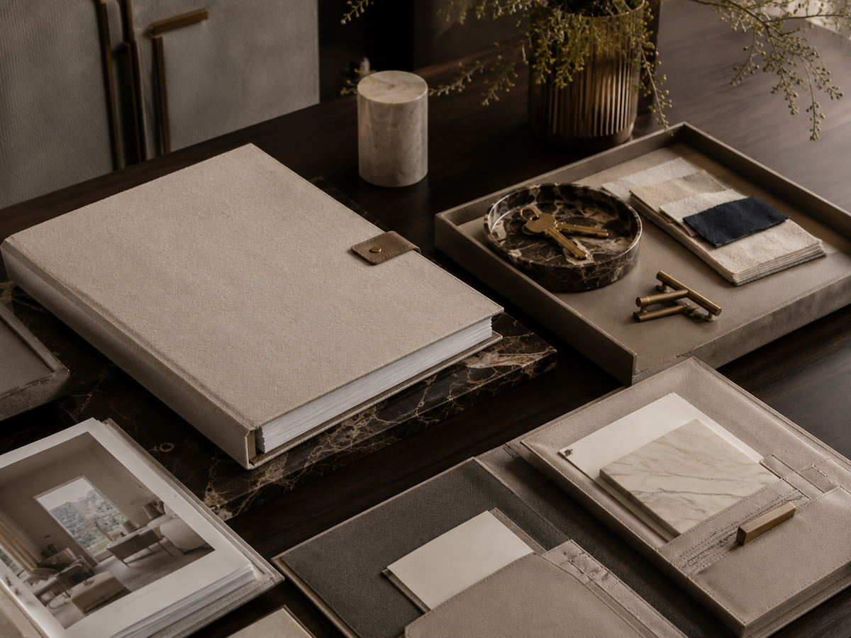 Luxury interior project closeout materials with completed documentation, final finish samples, keys, hardware, and continuity records